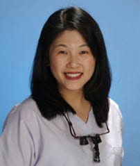 au_sub03s_01 A woman with long black hair wearing white shirt.